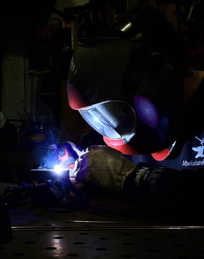 TIG welding a steel frame in the workshop